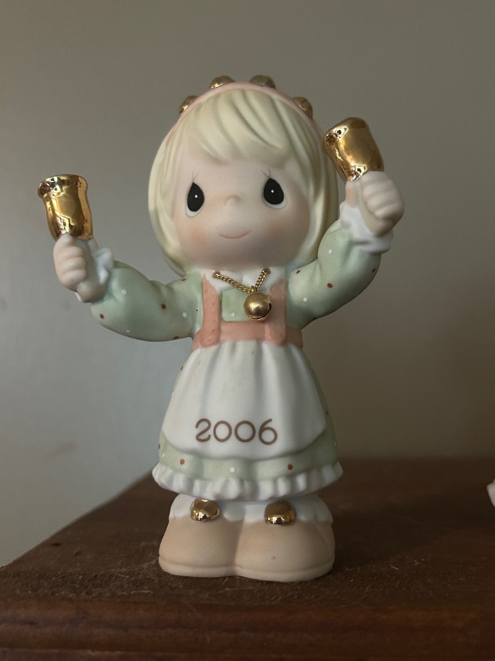 Precious Moments Green and Pink Girl Figurine with Gold Bells